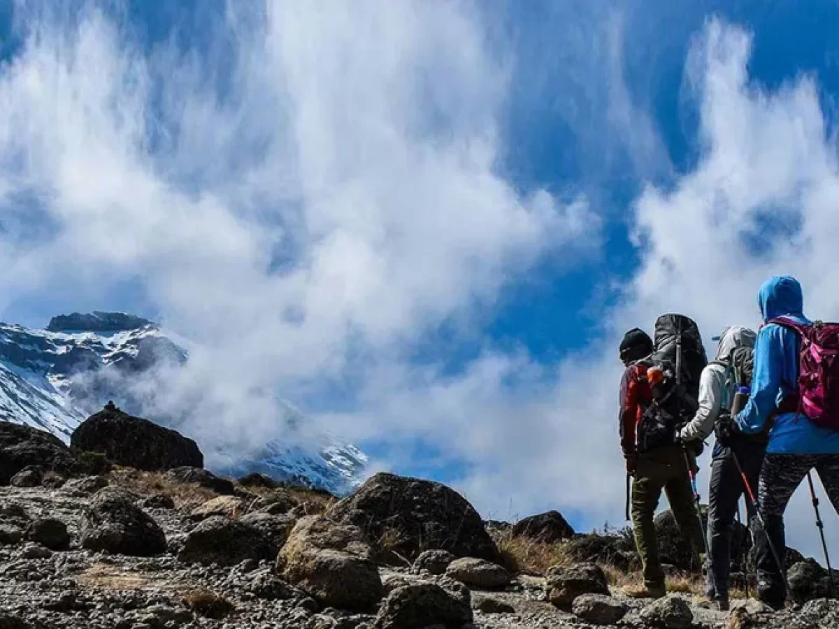 Trekkers walking toward the ice capped summit of Mount Kilimanjaro in Tanzania